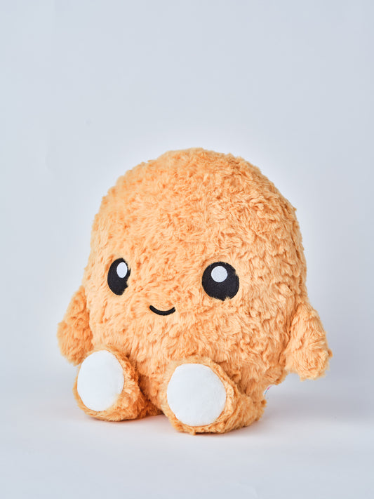 Adorable chicken nugget plush toy with a happy face, soft orange fuzzy texture, and round white feet, shown from a side angle on a white background โ perfect cuddly gift for kids and plush collectors.