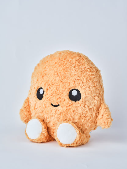 Adorable chicken nugget plush toy with a happy face, soft orange fuzzy texture, and round white feet, shown from a side angle on a white background — perfect cuddly gift for kids and plush collectors.