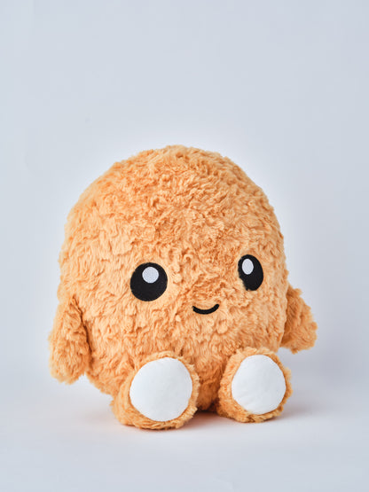Cute round plush toy with orange fuzzy fur, white feet, and a smiling face on a plain white background facing slightly right